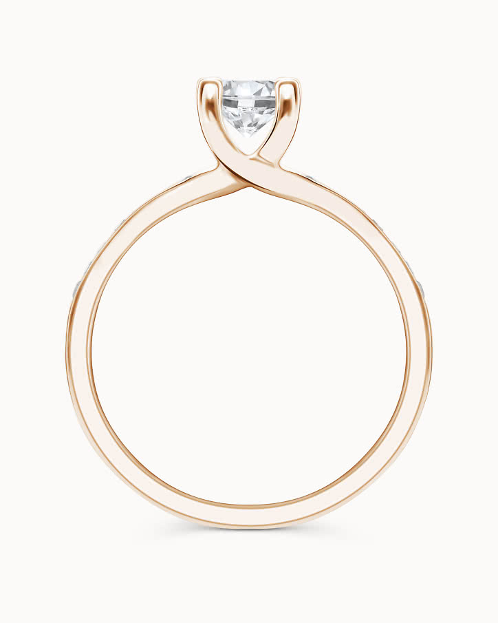 Side stone ring in 18K rose gold with a 0.5-carat center diamond from VANBRUUN