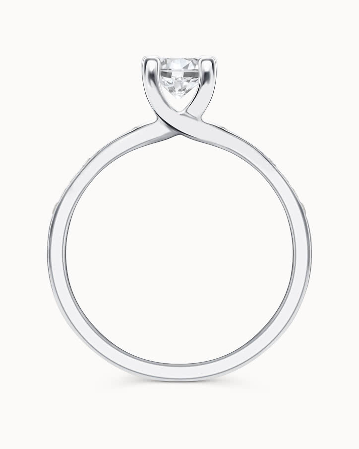 Side stone ring in 18K white gold with a 0.5-carat center diamond from VANBRUUN