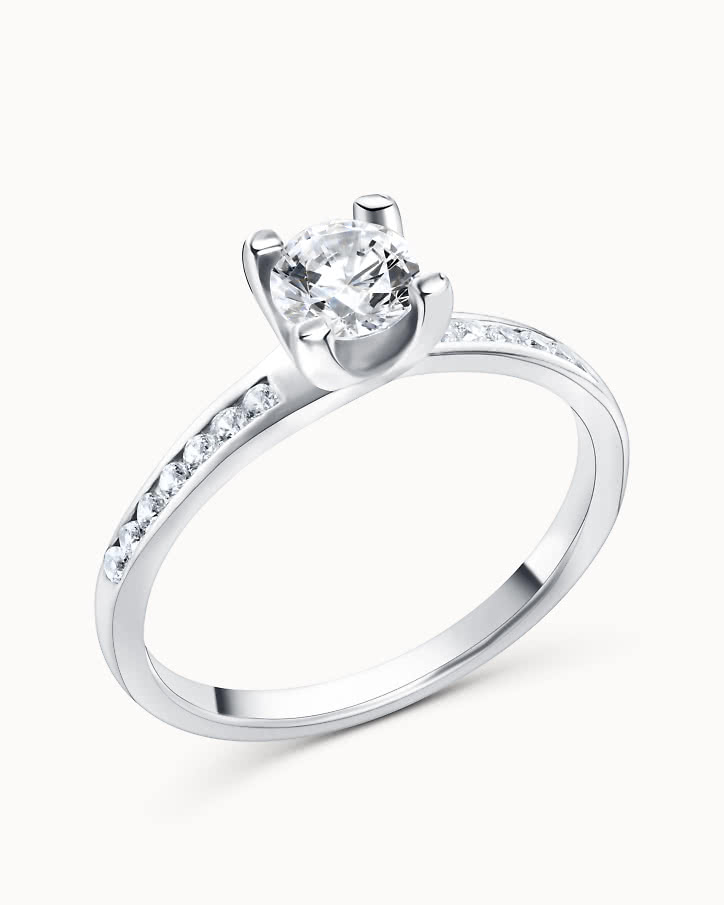 Side stone ring in 18K white gold with a 0.5-carat center diamond from VANBRUUN