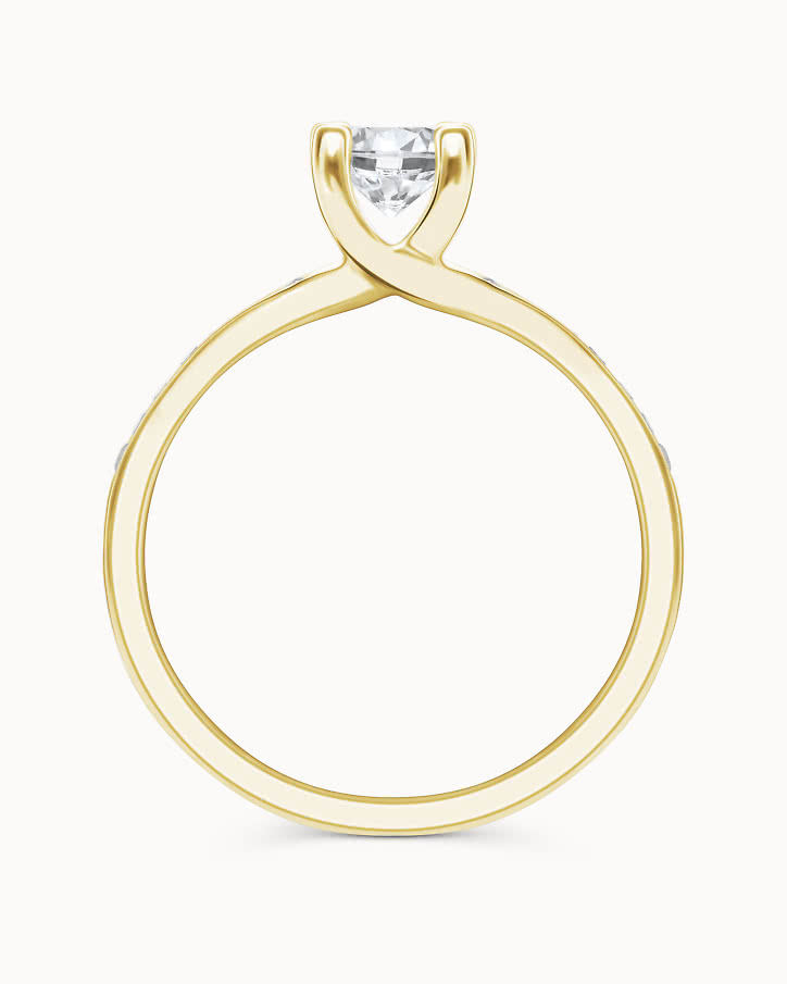 Side stone ring in 18K gold with a 0.5-carat center diamond from VANBRUUN