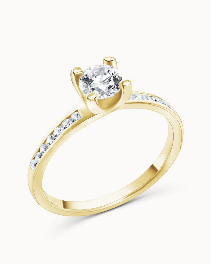 Side stone ring in 18K gold with a 0.5-carat center diamond from VANBRUUN