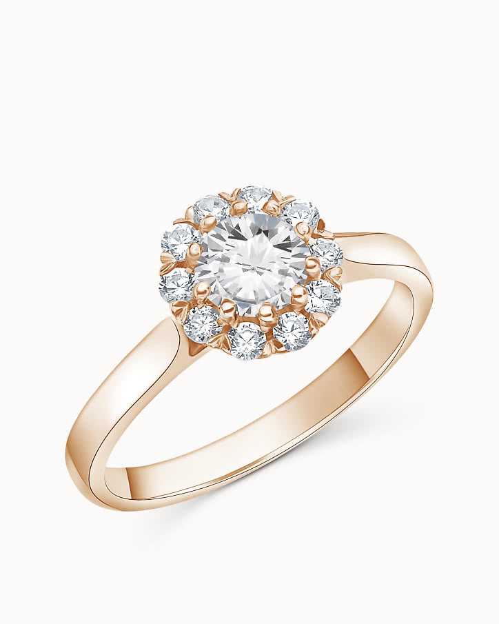 Halo engagement ring with lab-grown diamonds shaped like a flower in rose gold