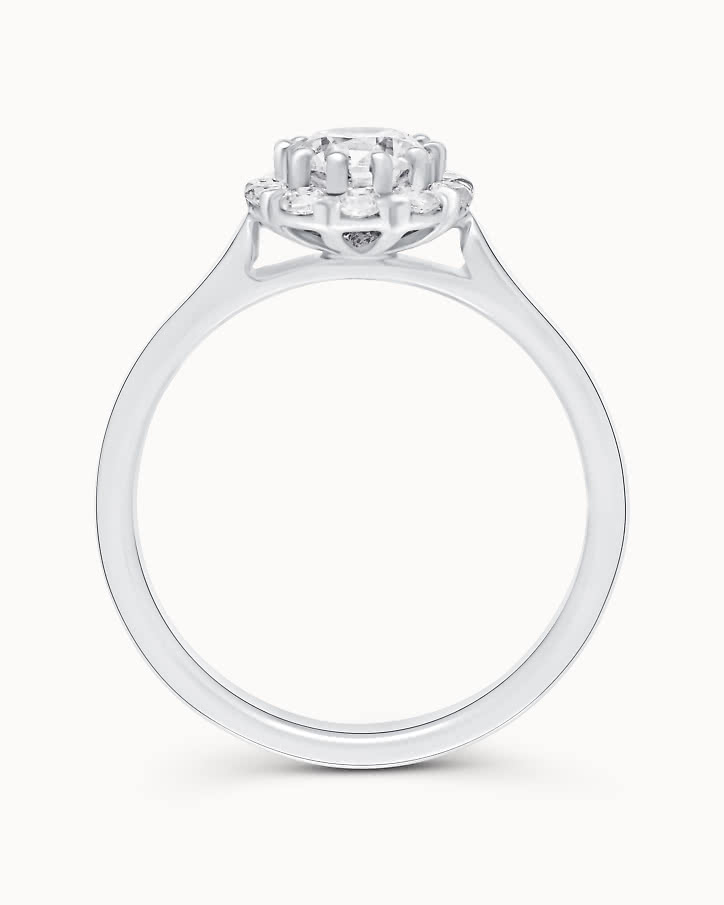 Halo engagement ring with lab-grown diamonds shaped like a flower in white gold