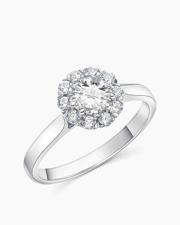 Halo engagement ring with lab-grown diamonds shaped like a flower in white gold